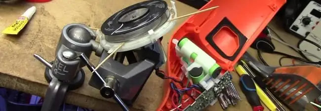 Vacuum cleaner repair parts and tools on a workbench in Jackson, MS