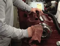 Vacuum repair technician cleaning and servicing a vacuum motor in Jackson, MS